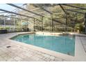 Enjoy a relaxing day by the pool in this screened-in enclosure, surrounded by a brick deck at 1924 Stonecrest Ct, Orlando, FL 32825