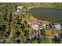 An aerial view showcasing the home's sprawling lot and proximity to a serene lake at 372 Rest Haven Rd, Geneva, FL 32732