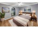 Comfortable bedroom featuring modern decor, neutral tones, a decorative rug, and ample natural light at 5030 Creekview Ln, Lakeland, FL 33811