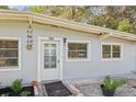 Close-up of front door and surrounding windows, showcasing the home's entry at 742 Valencia Ave, Orange City, FL 32763