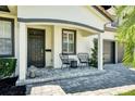 Welcoming front porch with stylish seating area and a charming entryway to the home at 777 S Denning Dr # B, Winter Park, FL 32789