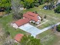 Overhead angle of this home showing a large lot, two-car garage, and neutral exterior at 9272 Gotha Rd, Windermere, FL 34786