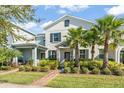 Inviting home with well-maintained landscaping and a charming brick walkway leading to the entrance at 11844 Pulitzer Pl, Orlando, FL 32832