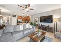 Open floor plan with the living room seamlessly connects to the kitchen, complete with tile flooring at 1625 Smokey Oak Way, Longwood, FL 32750
