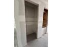 Empty closet space, ready for customization, with neutral walls and concrete floor at 1667 Meadowlark Dr, Deltona, FL 32725