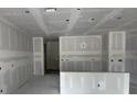 Open-concept living area with neutral walls and ample space for entertaining at 1667 Meadowlark Dr, Deltona, FL 32725