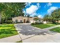 Well-maintained single Gathering home with an attached garage, driveway, and beautiful yard at 1679 Shadowmoss Cir, Lake Mary, FL 32746