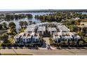 Stunning aerial view of modern townhomes with lake access, showcasing the beautiful community layout at 1816 Mondrian Cir, Winter Park, FL 32789