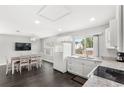 Bright, open kitchen with sleek white cabinets, granite countertops, and modern appliances at 2361 Carriage Run Rd, Kissimmee, FL 34741