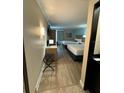 Comfortable bedroom with two beds, desk, luggage rack, and stylish décor creates a relaxing atmosphere at 3000 Maingate Ln # 520, Kissimmee, FL 34747