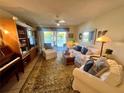 Cozy living room with water views, comfortable seating, and stylish decor at 400 E Orlando Ave # 10 C, Ocoee, FL 34761