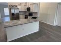 Kitchen features stainless steel appliances, gray countertops, and white subway tile backsplash at 403 Britten Dr, Kissimmee, FL 34758