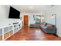 Bright living room boasts hardwood floors, recessed lighting, and a comfortable seating area with a large sectional sofa at 6 Winding Ridge Rd, Casselberry, FL 32707