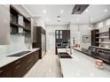 Gourmet kitchen featuring stainless steel appliances, custom cabinets, and spacious countertops at 743 Mills Estate Pl, Chuluota, FL 32766