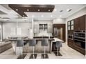 Modern kitchen featuring stainless steel appliances, sleek cabinetry, and a large island with seating at 743 Mills Estate Pl, Chuluota, FL 32766