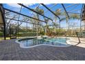Enclosed pool area with mature landscaping creating a private oasis at 743 Mills Estate Pl, Chuluota, FL 32766