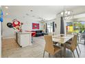 Bright living area seamlessly connected to the kitchen and dining, ideal for modern living at 8959 Stinger Dr, Champions Gate, FL 33896