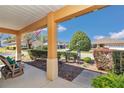 Inviting porch with cozy seating and a pleasant view of the neighborhood at 9491 Sw 98Th Ct, Ocala, FL 34481