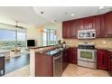 Modern kitchen featuring stainless steel appliances and breakfast bar at 101 S Eola Dr # 910, Orlando, FL 32801