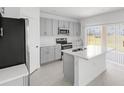 Modern kitchen with stainless steel appliances, stone countertops, and sleek cabinetry at 144 Jones Fish Camp Rd, Edgewater, FL 32141
