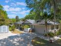 Spacious home with a large driveway, garage, shed and screened in patio at 1511 Grandview Blvd, Kissimmee, FL 34744