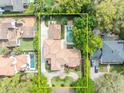 Stunning aerial view of the property showcasing the house, pool, and landscaped yard at 1630 Lasbury Ave, Winter Park, FL 32789