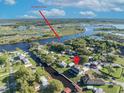 Aerial view of waterfront home on a canal with easy access to the St. John's River at 2072 Starboard Dr, Geneva, FL 32732