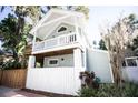 Two story home with a cozy second story balcony and well manicured landscape at 2211 Oberlin Ave, Orlando, FL 32804