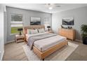 Stylish main bedroom featuring a bed, a ceiling fan, carpet floors, and neutral paint at 2701 Bullion Loop, Sanford, FL 32771