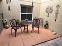 Cozy patio with seating and decorative elements, perfect for outdoor relaxation at 482 Windmeadows St # 482, Altamonte Springs, FL 32701