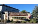 A decorative stone sign announces the entrance to Split Oak Estates at 5647 Barletta Dr, St Cloud, FL 34771