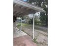 View of the backyard featuring a covered patio overlooking a lawn at 5915 Colchester Dr, Orlando, FL 32812