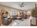 Inviting living room features tile flooring, neutral walls, and stylish leather furniture set at 9673 Sw 63Rd Loop, Ocala, FL 34481