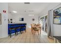 Charming dining area with bar seating and a sliding glass door leading to the outdoors at 1001 Park Ridge Cir, Kissimmee, FL 34746
