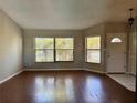 Inviting living room with wood flooring, large windows, and ample natural light at 1509 Jason St, Kissimmee, FL 34744