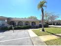 Exterior view of home featuring desert landscaping and an arched entryway at 209 Esplanade Way # 109, Casselberry, FL 32707