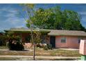 Charming single-story home featuring a cozy front porch and a well-maintained lawn at 4845 Elese St, Orlando, FL 32811