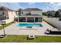 Outdoor living space showcasing a stunning pool, patio, and outdoor kitchen with a basketball hoop at 5201 Villa Rosa Ave, St Cloud, FL 34771