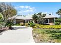 Lovely single-story home with a well-maintained lawn and mature landscaping at 8905 South Bay Dr, Orlando, FL 32819