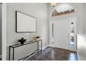 Inviting foyer with a decorative front door and stylish tile flooring at 8905 South Bay Dr, Orlando, FL 32819