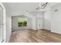 Bright living room featuring hardwood floors, vaulted ceilings and lots of natural light at 1028 Henson Ct, Oviedo, FL 32765