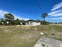 Image of a single-Gathering house with cinder blocks in an undeveloped area at 1201 Apopka Ln, Kissimmee, FL 34759