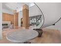 Spacious foyer with hardwood floors and an elegant winding staircase at 14645 Isleview Dr, Winter Garden, FL 34787