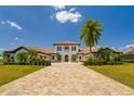 Beautiful single-Gathering home featuring a lush green lawn and a brick driveway at 14645 Isleview Dr, Winter Garden, FL 34787