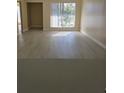 Bright living room featuring light-colored flooring and large windows at 1864 Caralee Blvd # 3, Orlando, FL 32822