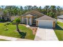 Charming single-story home featuring a well-manicured lawn, attached garage, and inviting entrance with bright sunshine at 3180 Town And Country Rd, Oviedo, FL 32766