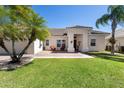 Beautiful home with a well-manicured lawn and a cozy front porch with seating at 3403 Great Pond Dr, Kissimmee, FL 34746