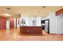 Spacious kitchen with modern stainless steel appliances and a large island at 3403 Great Pond Dr, Kissimmee, FL 34746