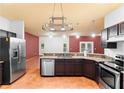 Well-equipped kitchen with granite countertops and stainless steel appliances at 3403 Great Pond Dr, Kissimmee, FL 34746