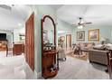 Bright living room showcasing tile floors, stylish furnishings, and an open concept layout to the kitchen at 4442 Glenview Ln, Winter Park, FL 32792